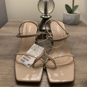 Beige, patent leather high heeled sandals